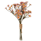 Full view of a pink and cream artificial daisy bunch with yellow centres, branching olive-grey stems and tan cord wrapped around the lower stems.