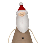 Close-up of Santa's red hat with white trim and pompom, black dot eyes, rounded nose and long cream-white beard.