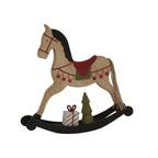 Angled view of the rocking-horse decoration showing its dark paired rockers, trailing cord tail, green tree and white present with red ribbon.
