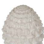 Close-up of the ornament's rounded overlapping scales, showing glossy highlights and fine grey-beige crackle lines.