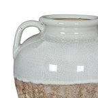 Close-up of the vase shoulder and left handle, with pale crackle glaze meeting the rough mottled brown surface below.