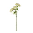 Full view of a cream artificial flower spray with broad floret clusters, rounded green leaves and a long branching stem against white.