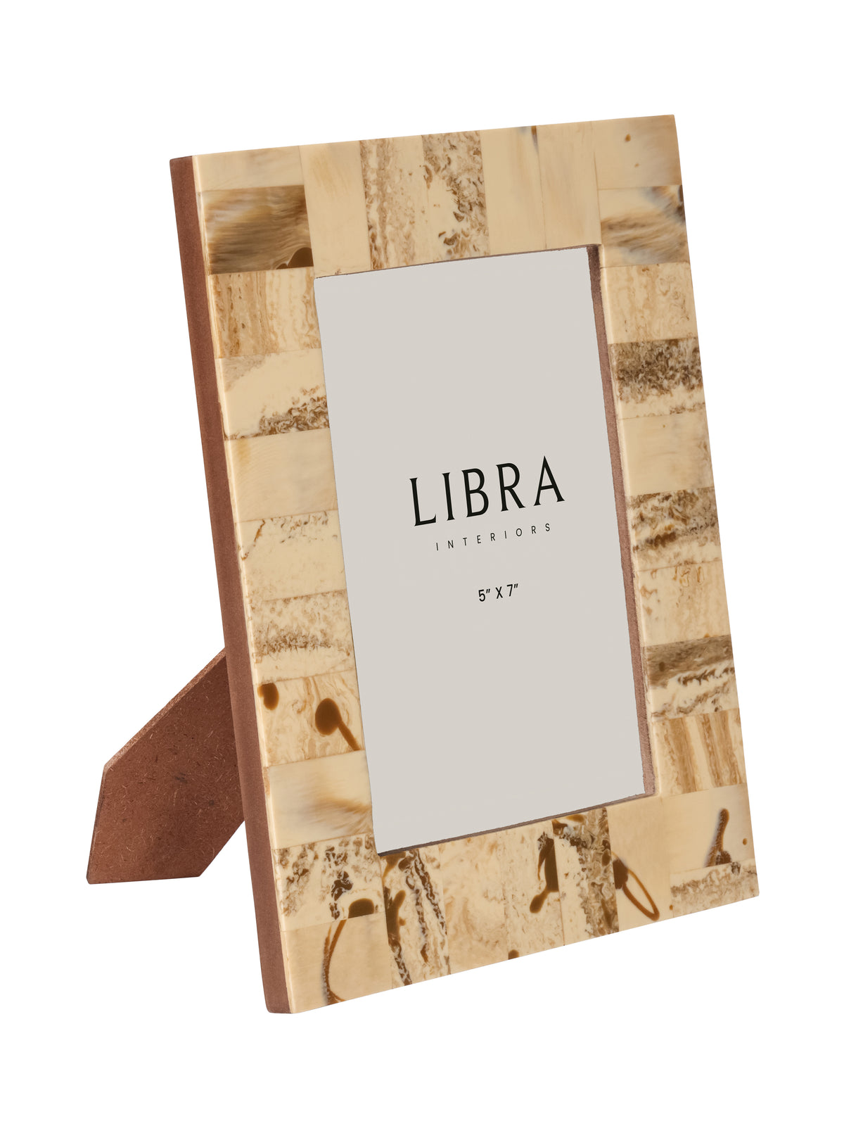 Angled front view of the cream patchwork photo frame with a broad patterned border and brown rear stand.