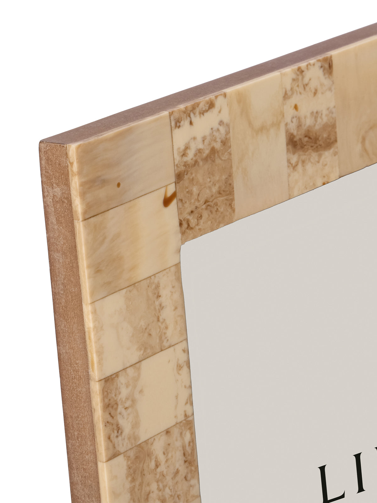 Close-up of the upper left corner, showing pale patchwork panels and brown swirling markings.