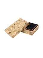 Cream patchwork box with its removable lid resting diagonally across the front, revealing the dark-lined interior.