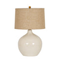 Table lamp on a white background with a glossy cream-white teardrop body, tapered textured beige shade and small gold-coloured finial.