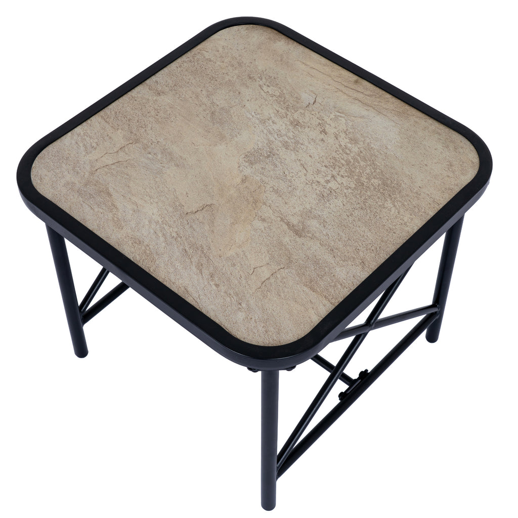 View from above of the pale mottled square table top within its rounded black border.