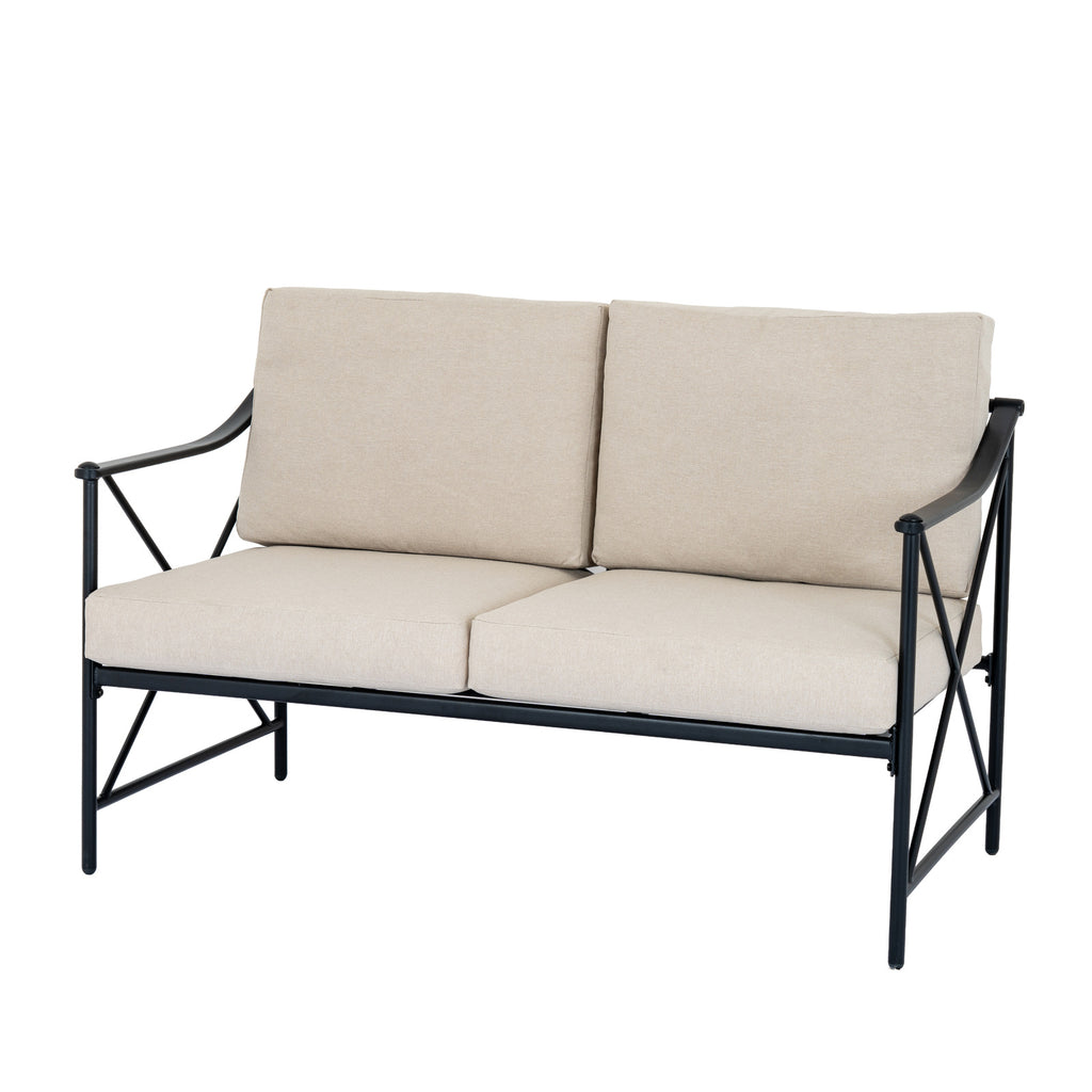 Angled view of the bench showing paired beige seat and back cushions, swept black arms and crossed side braces.