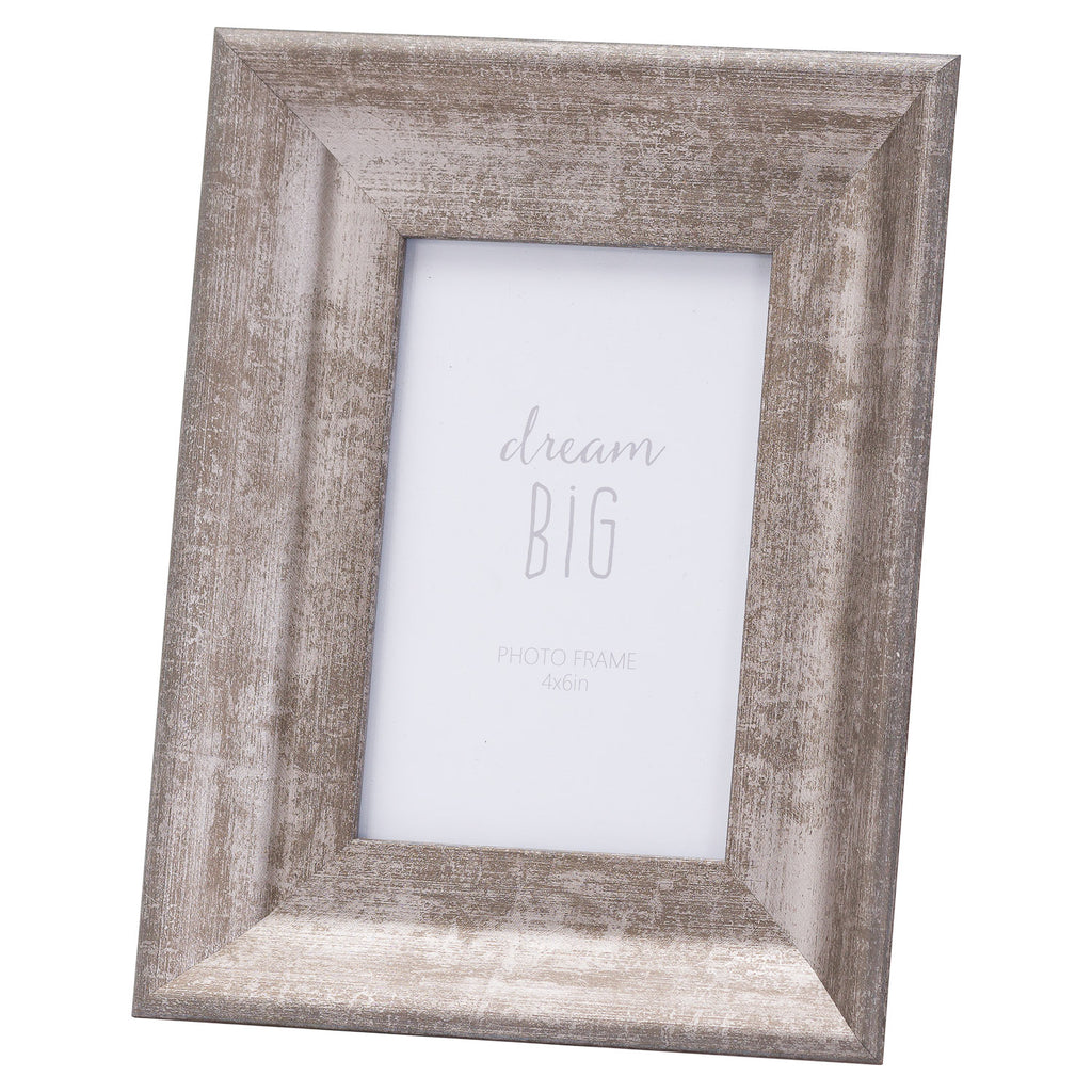 Angled view of a portrait photo frame with a broad sloping silver-grey surround, distressed linear markings and a white dream BIG placeholder.