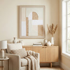 Crosshatched Archfields Framed Artwork displayed above a pale wood sideboard with neutral ceramics, beside a cream armchair and a window.