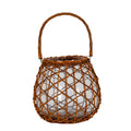 Brown lantern on a white background, with a rounded tapering body, crossing open weave, clear cylindrical insert and raised arched loop handle.