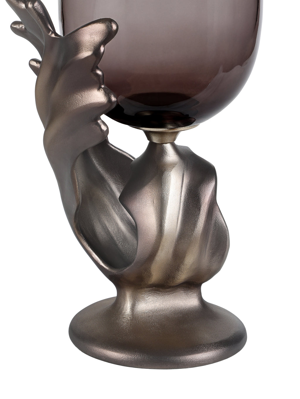 Detail of the textured metallic base with sweeping folds, an open curl and a round foot beneath the glass.