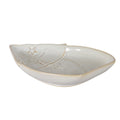 Low angled view of the cream-white Santa dish showing its shallow bowl, raised tan-edged rim and stars across the hat.