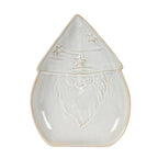 Overhead view of the Santa-shaped dish with a pointed hat, three stars, outlined smiling face and long curling beard.