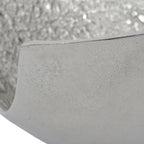 Close-up of the smooth outer wall and rim, with fine surface markings and the textured interior behind.