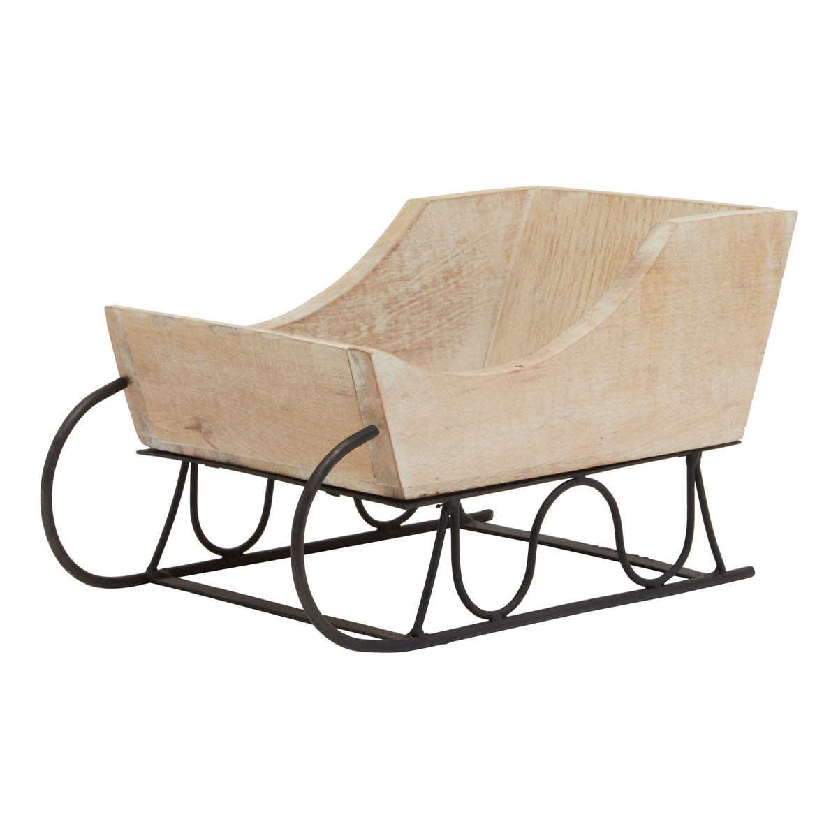 Front three-quarter view of a pale decorative sleigh with curved sides, a black frame and runners curling upwards at the front.