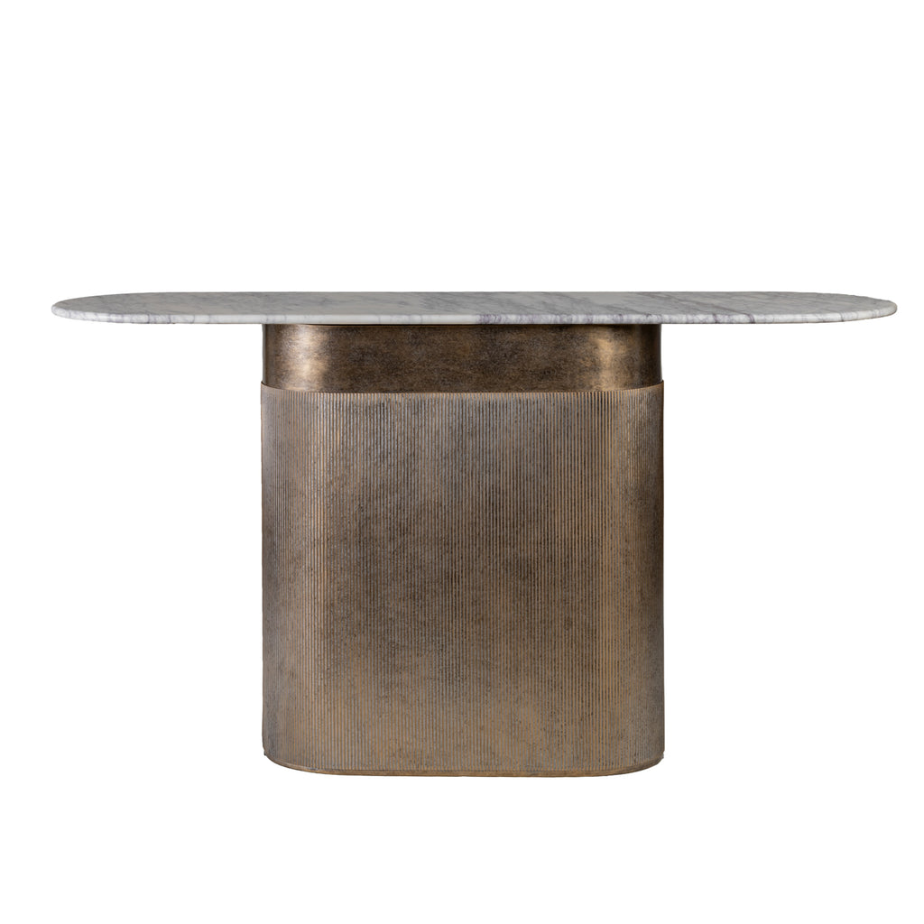 Front view of a console table with an elongated pale marble top and a champagne gold column base with fine vertical fluting.