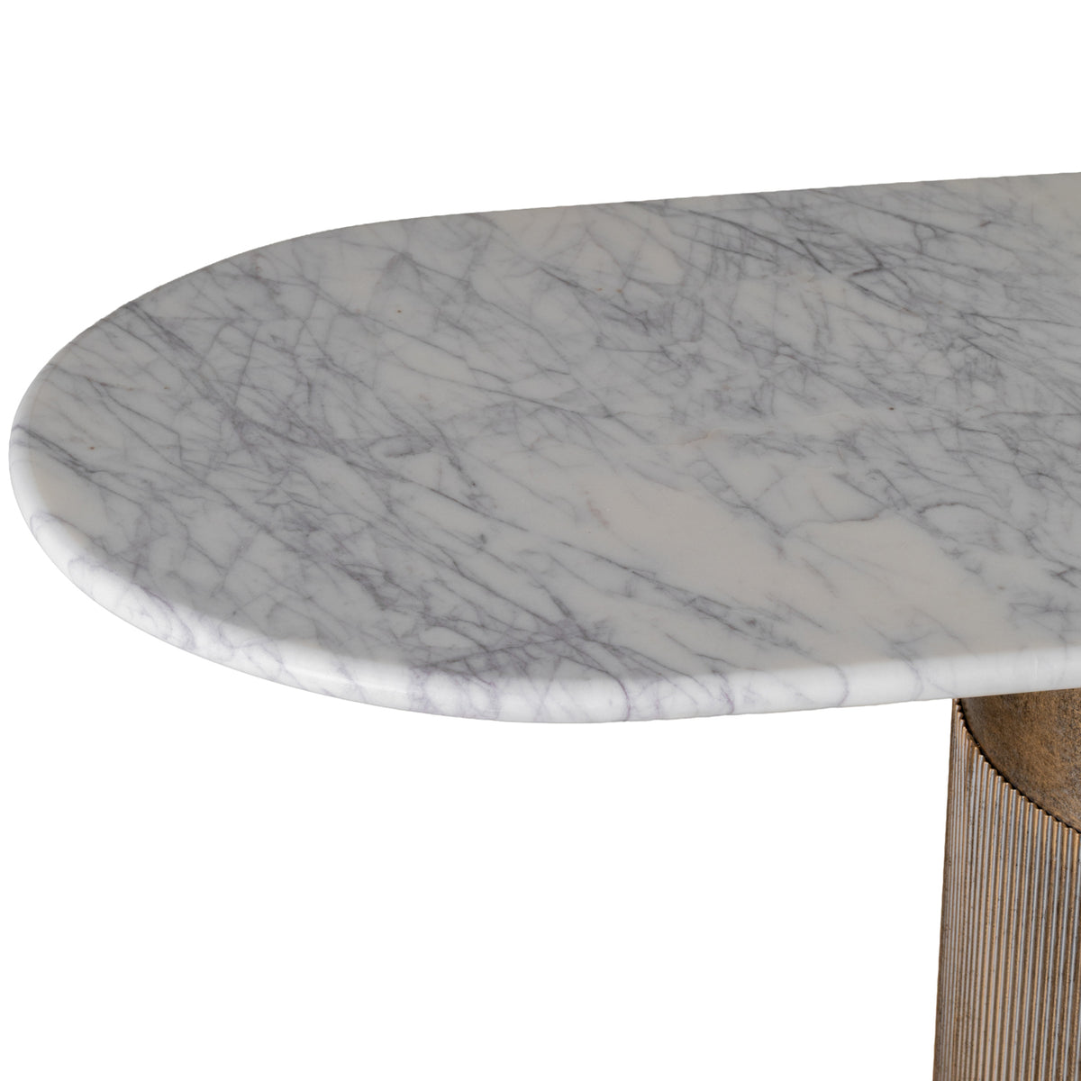 Close-up of the marble top's rounded end, showing grey veining across the pale surface and edge.