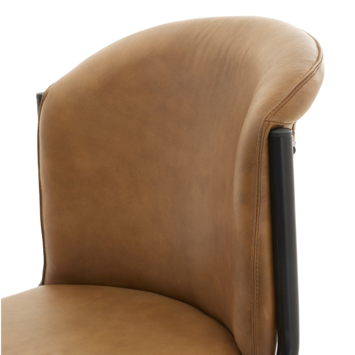 Detail of the curved brown back and adjoining seat, with stitching running down the right side and dark tubes at either edge.