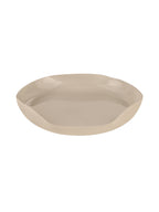 Cream decorative tray viewed at an angle, showing its irregular outline and glossy interior.