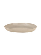 Low side view of the cream tray showing its shallow profile and upward-curving rim.