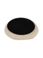 Underside of the tray with a dark central base surrounded by the cream outer edge.