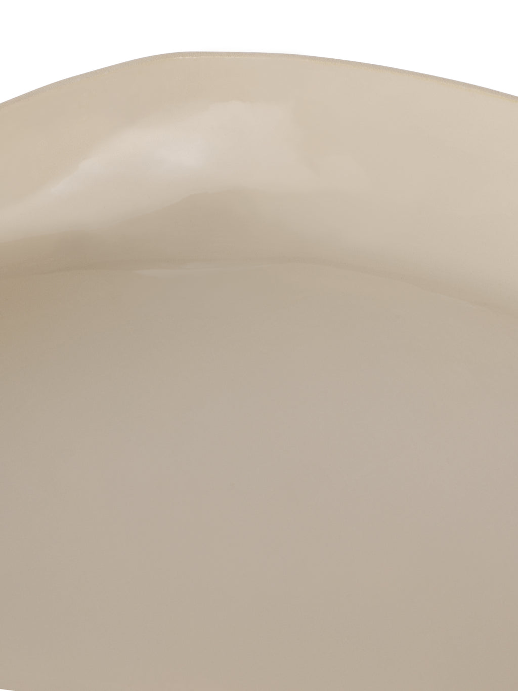 Close-up of the glossy cream interior and gently uneven upper rim.