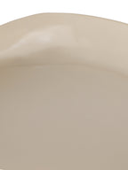Close-up of the glossy cream interior and gently uneven upper rim.