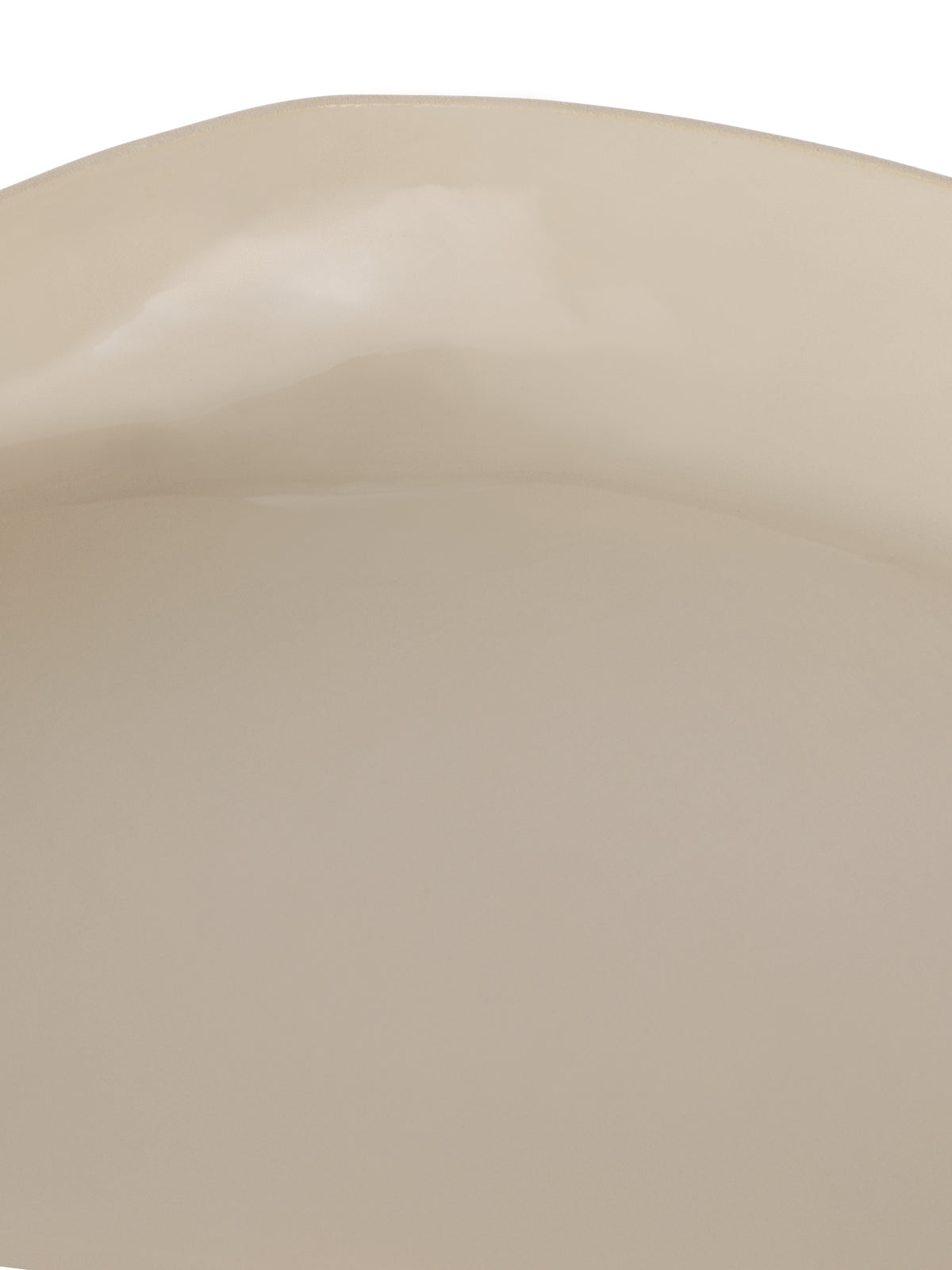 Close-up of the glossy cream interior and gently uneven upper rim.