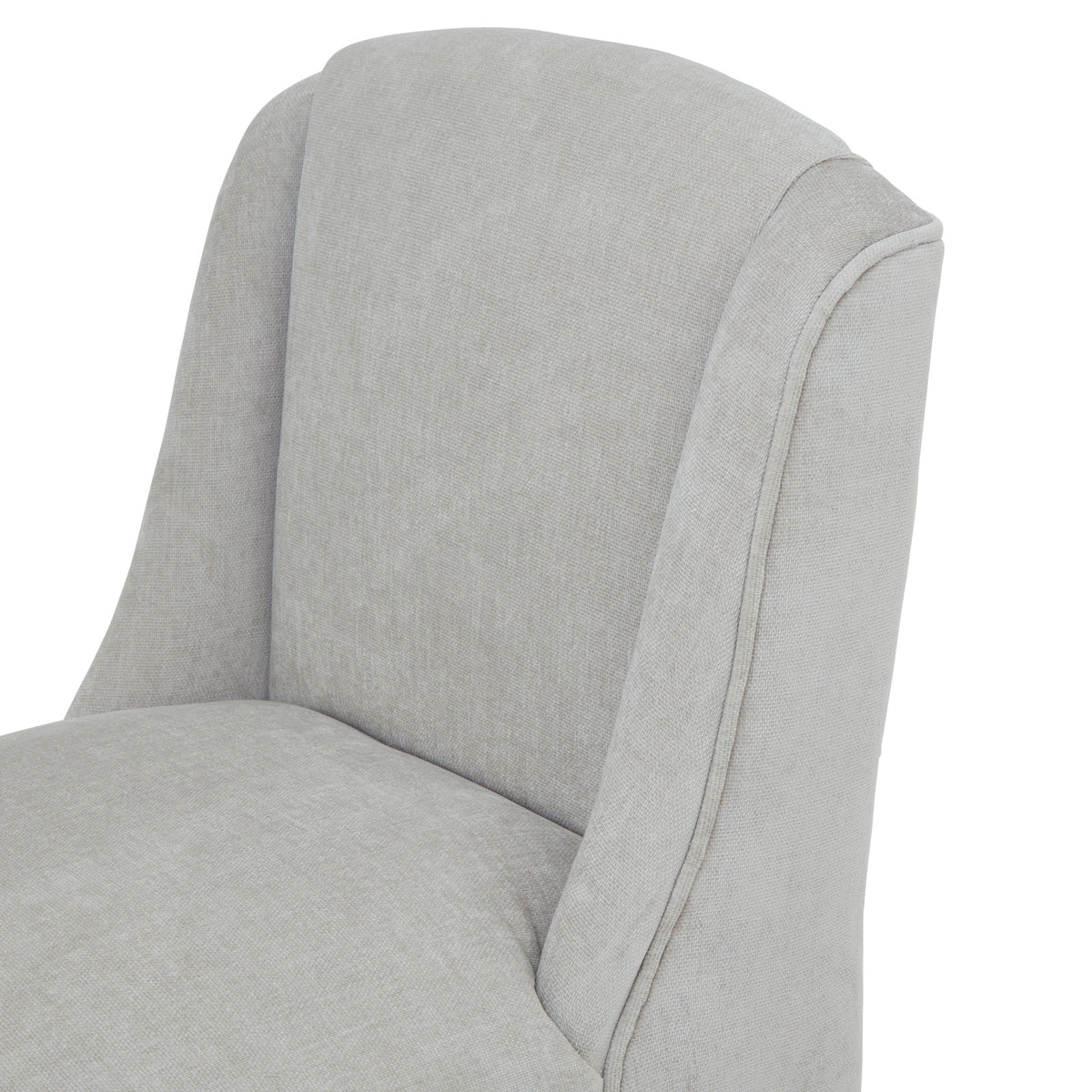 Close-up of the curved pale grey back and sweeping side wings, with fine woven texture and piping along the outer edge.