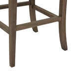 Close-up of the stool's brown grain-patterned legs and rectangular stretchers, showing the gently curved rear legs.