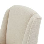 Close-up of the curved top of the cream chair back and narrow side wings, showing the small loops in the covering.