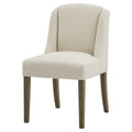 Front angled view of a cream loop-textured dining chair with a tall curved wing back, padded seat and four brown legs.