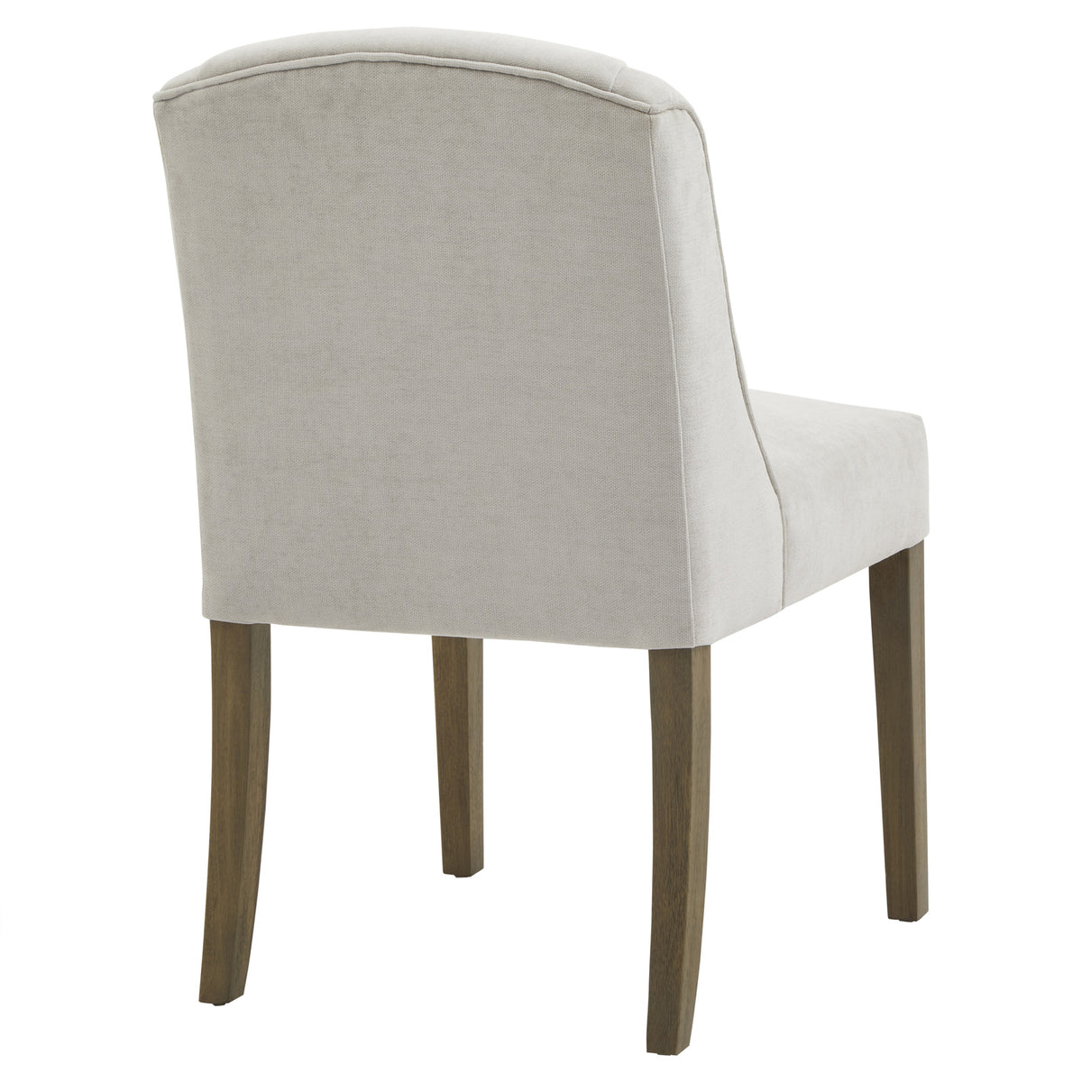 Rear three-quarter view showing the chair's pale grey covered back, piping along its arched top edge and brown legs.