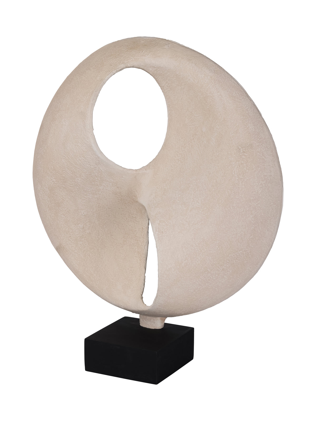 Angled view of the cream cutout sculpture, showing its curved surface and the depth of the black base.