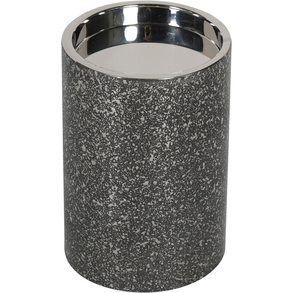 View from above of the empty candle holder, showing its reflective recessed interior and textured sides.