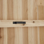 Rear close-up of the clock showing a black toothed hanger screwed to a horizontal strip across the light wood-coloured backing.