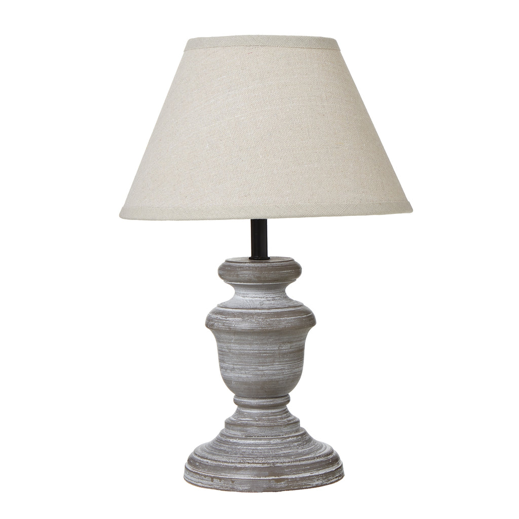 Darkneck Urn Table Lamp with a pale tapered shade, dark neck and grey-brown urn-shaped base on a round foot
