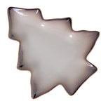 Overhead view of a tree-shaped dish with stepped branches, a pale speckled centre and a dark rim edged in tan.