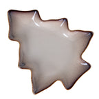 Overhead view of a tree-shaped decorative dish, with a pale speckled basin, dark stepped rim and fine tan edging.