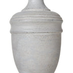 Close-up of the pale urn-shaped lamp body showing rounded bands and mottled, rubbed surface marks.