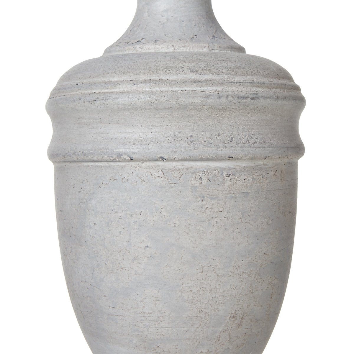 Close-up of the pale urn-shaped lamp body showing rounded bands and mottled, rubbed surface marks.