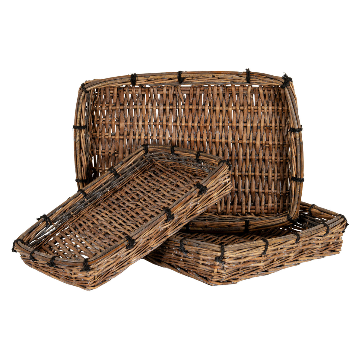 Three brown rectangular woven trays arranged together, with one upright and one angled across the front, showing open interlaced bases, bundled rounded rims and dark ties.