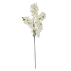 Full view of the artificial blossom stem, with dense white flowers on dark branches above a long bare stalk.