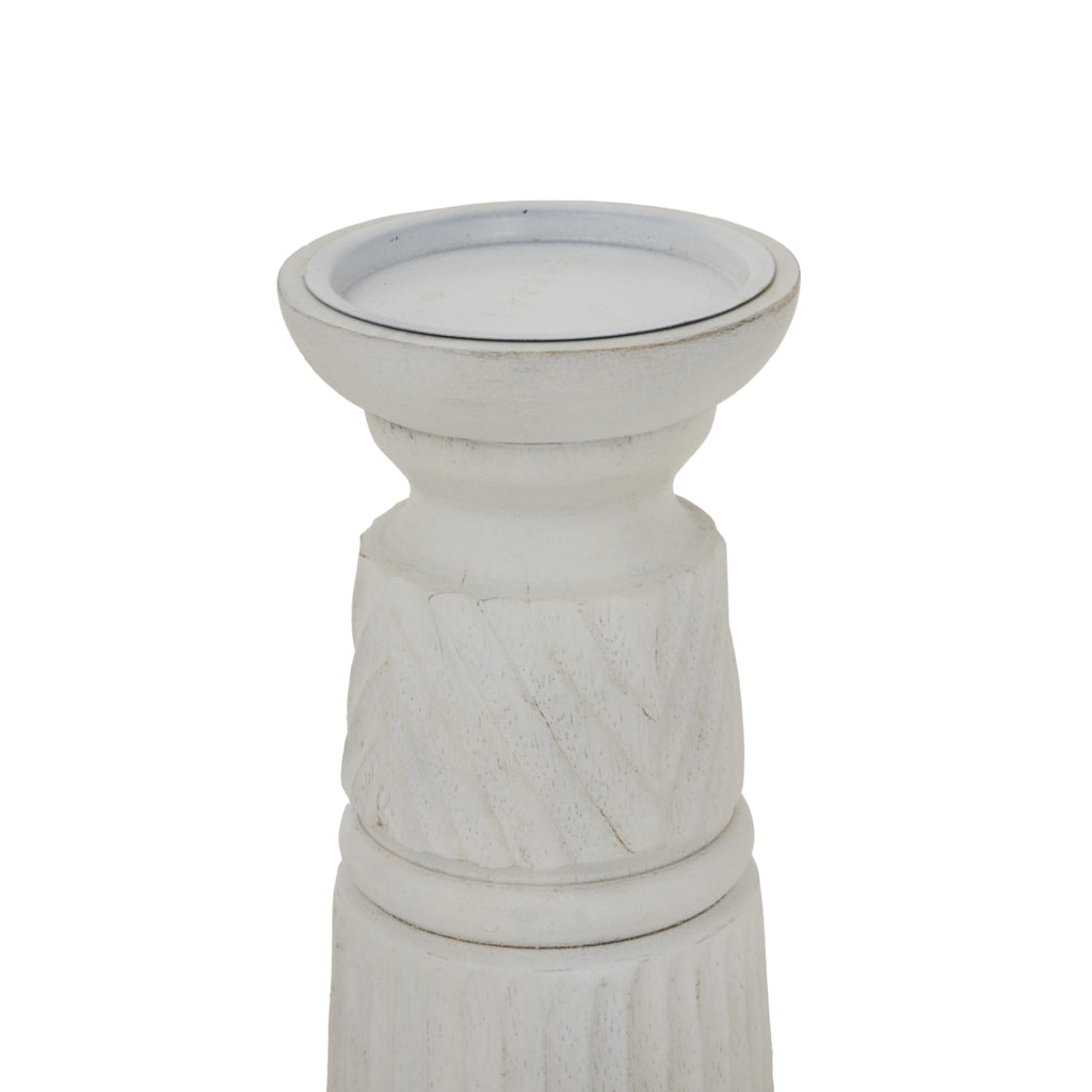 Close-up of the candle holder's broad recessed top and narrowed neck, with pale diagonal relief bands and darker marks along the edges.
