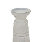 Close-up of the candle holder's broad recessed top and narrowed neck, with pale diagonal relief bands and darker marks along the edges.