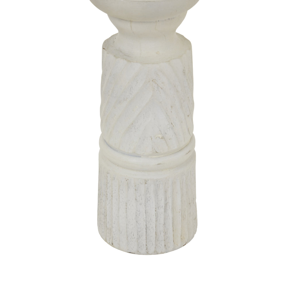 Detail of diagonal grooves above rounded dividing bands and a vertically fluted base, with darker markings showing through the whitewashed finish.
