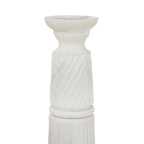 Close view of the candle holder's recessed top and curved neck above the pale diagonal relief bands.