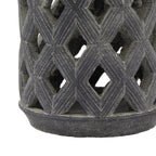 Close-up of the lower diamond lattice and circular base, showing parallel lines along the diamond shapes and the weathered grey surface.