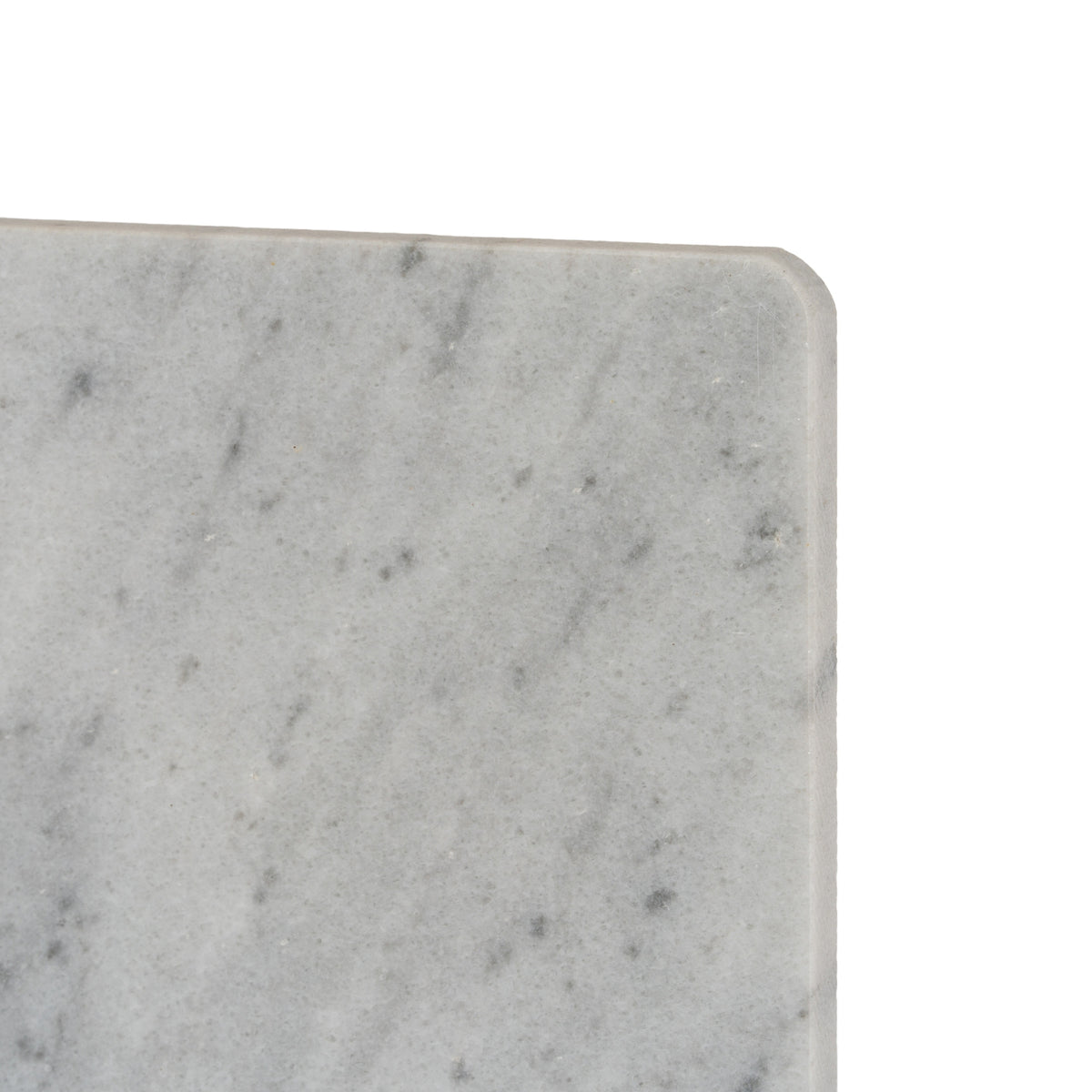 Close-up of the serving board's rounded corner and softened edge, showing hazy grey markings across the pale surface.